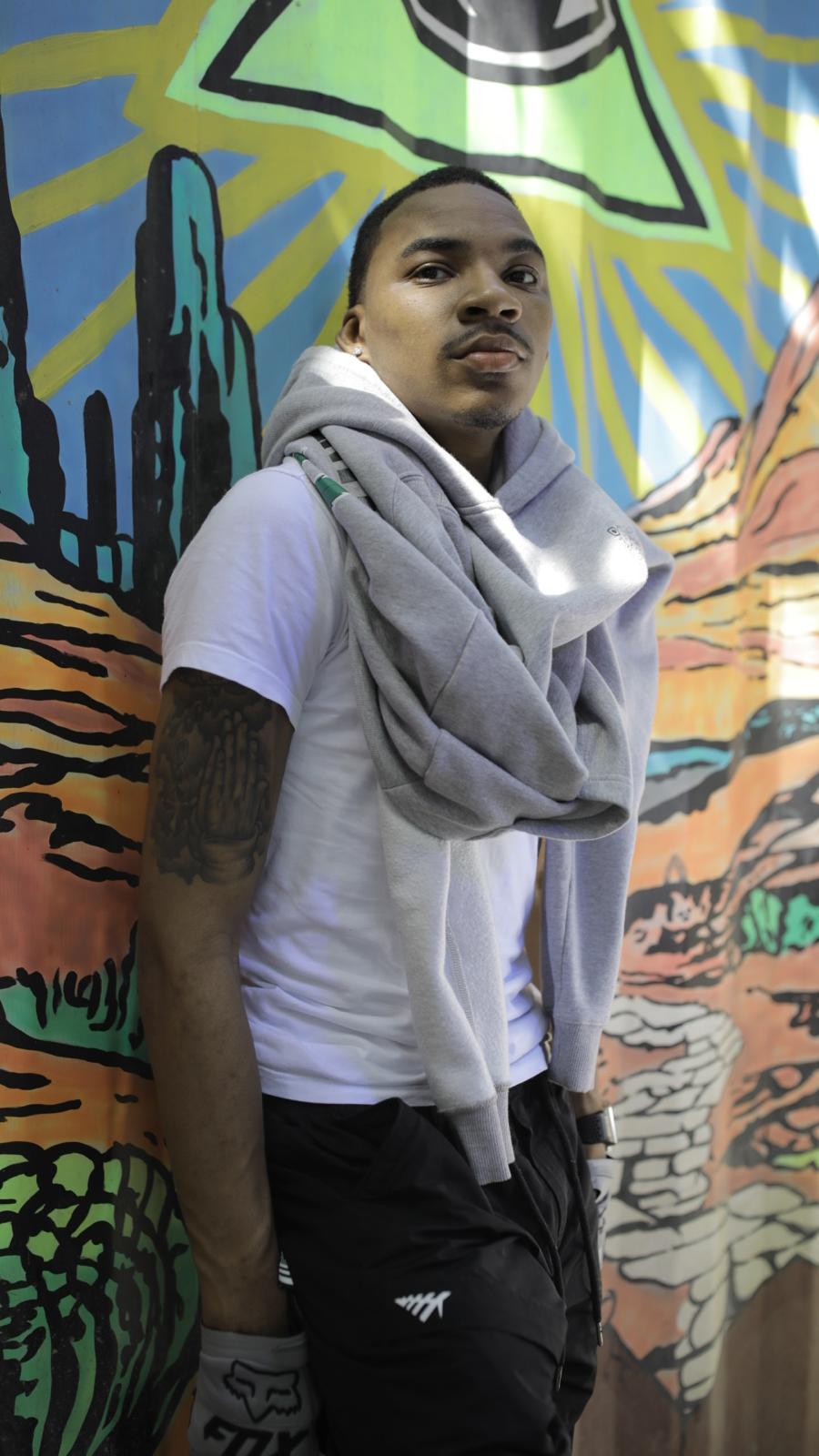 Trey Veezy portrait against mural