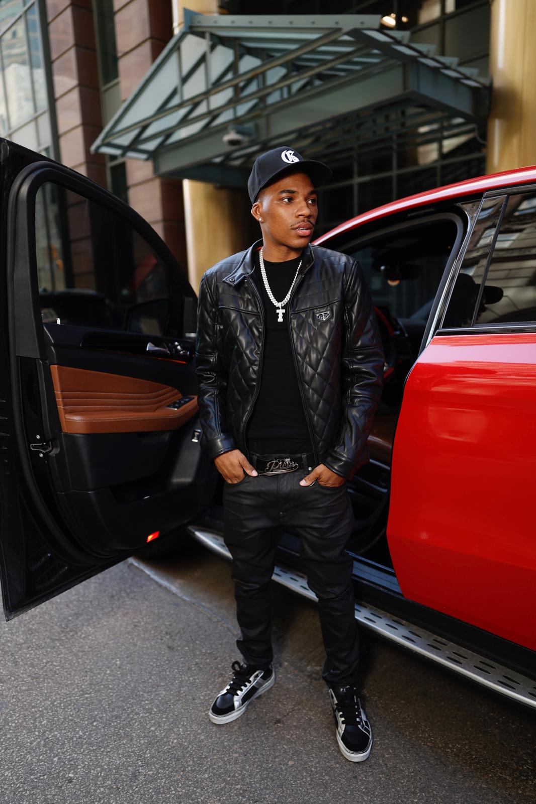 Trey Veezy in front of vibrant Cleveland mural